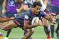 Storm front: Melbourne's Felise Kaufusi tries to evade a Broncos tackle at AAMI Park in round three.