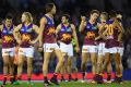 Lions players look dejected after losing the round five AFL match against the Western Bulldogs on Saturday.