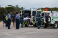 Emergency workers including Esperance St John Ambulance community paramedic Paul Gaughan try to save shark attack victim ...