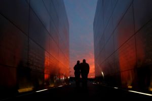 A couple walks through the Empty Sky Memorial at sunset at Liberty State Park, Wednesday, April 5, 2017, in Jersey City, ...