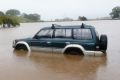 Water, water everywhere: A car is trapped in the floods in Murwillumbah.