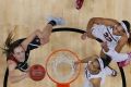 Alanna Smith, left, shoots past South Carolina forward A'ja Wilson (22) and guard Allisha Gray.