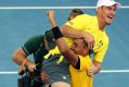 Team captain Lleyton Hewitt, top, celebrates with Nick Kyrgios of Australia after he won his match against Sam Querrey ...