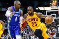 LeBron James drives to the basket against Atlanta Hawks forward Paul Millsap.