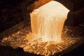 Molten copper flows from a furnace into a mould at the copper mining and smelting complex in Serbia.