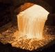 Molten copper flows from a furnace into a mould at the copper mining and smelting complex in Serbia.