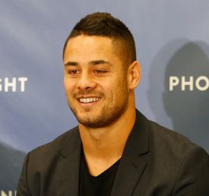 Happier days: Jarryd Hayne with Gold Coast coach Neil Henry after he signed with the Titans last season.