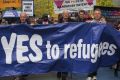 Church leaders and others take part in the pro-refugee rally on Palm Sunday.