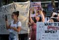 Joyful: Feminists, gender equity activists, and general supporters of women's rights rallied to mark International ...