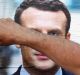 A supporter of French centrist presidential candidate Emmanuel Macron glues a campaign poster in Bayonne, south-western ...