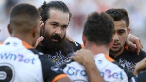 Still focused: Aaron Woods addresses the Tigers in a team huddle.