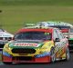 Chaz Mostert ahead of Mark Winterbottom during race 6 for the Phillip Island 500.