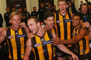 MELBOURNE, AUSTRALIA - APRIL 23: Tom Mitchell of the Hawks celebrates his first win the teammates during the round five ...