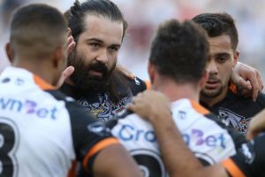 Still focused: Aaron Woods addresses the Tigers in a team huddle.