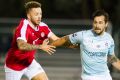 Belconnen United football club v Canberra United. Belconnen's Matthew Grbesa getting past Canberra's Thomas James