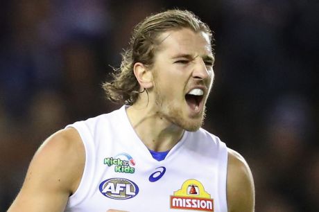 Marcus Bontempelli celebrates after kicking a goal for the Bulldogs at Etihad on Good Friday.