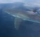 Craig Hudson managed to capture the shark circling his boat 