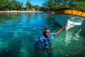 Jackson Kiloe, the Premier of Taro in the Solomon Islands, standing where the shoreline used to be. 