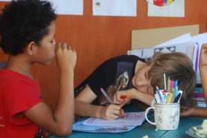 Cabbage and cartooning with friends on the home-school porch.