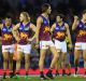 Lions players look dejected after losing the round five AFL match against the Western Bulldogs on Saturday.