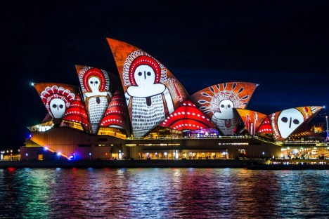 The sails of the Opera House painted in light.