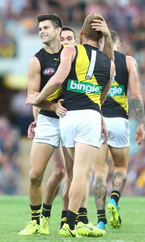 Trent Cotchin celebrates a goal against the Lions.