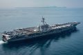 In this Saturday, April 15, 2017 photo released by the U.S. Navy, the aircraft carrier USS Carl Vinson transits the ...