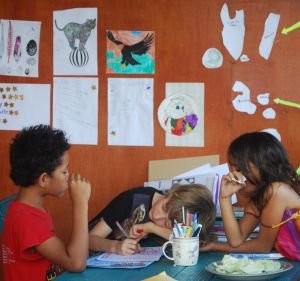 Cabbage and cartooning with friends on the home-school porch.