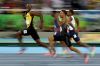 Smile for the camera: Usain Bolt competes in the men's 100m semi-final.