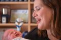 Kelly O'Dwyer, cabinet minister and member of powerful expenditure review committee, hard at work with her newborn baby. ...