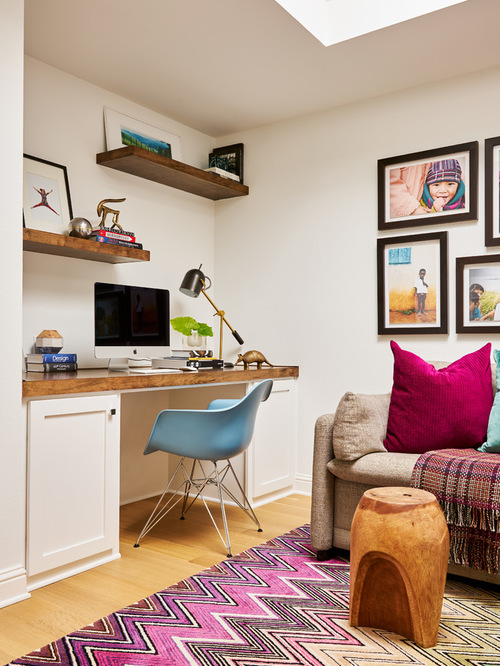 Photo of a mid-sized midcentury kids' room in Dallas with white walls and light hardwood floors.