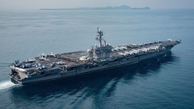 In this Saturday, April 15, 2017 photo released by the U.S. Navy, the aircraft carrier USS Carl Vinson transits the ...