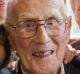 WWII veteran John Hendry surrounded by great-grandchildren after participating in the 2017 Anzac Day National Ceremony.