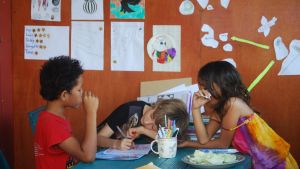 Cabbage and cartooning with friends on the home-school porch.