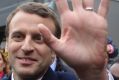 Centrist candidate Emmanuel Macron waves to supporters.