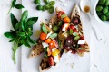 Neil Perry's bruschetta with cherry tomatoes, basil, olives and feta.