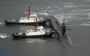 The nuclear-powered submarine USS Michigan approaches to join the U.S. aircraft carrier USS Carl Vinson in drills near the Korean Peninsula, at Busan port in Busan, South Korea, Tuesday, April 25, 2017.