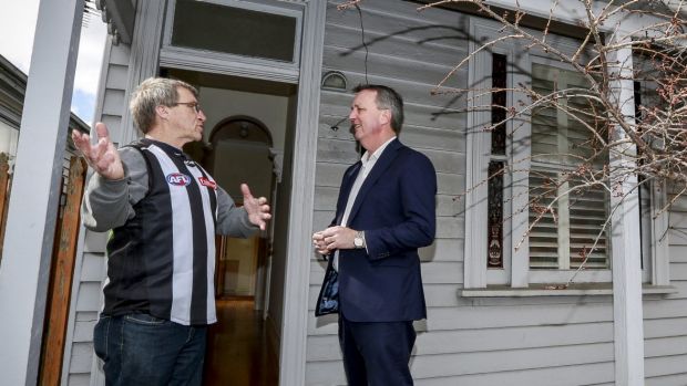 Housing Minister Martin Foley and homelessness program resident Trevor Wulf at a Collingwood house that was acquired for ...
