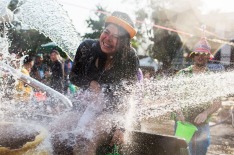 Thai locals and foreigners take part in a city-wide water fight in Chiang Mai, Thailand.
