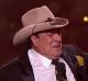 Molly Meldrum gifts Samuel Johnson with a golden Stetson.