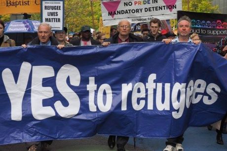 Church leaders and others take part in the pro-refugee rally on Palm Sunday.