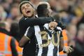 Newcastle United's Christian Atsu celebrates promotion with teammates.