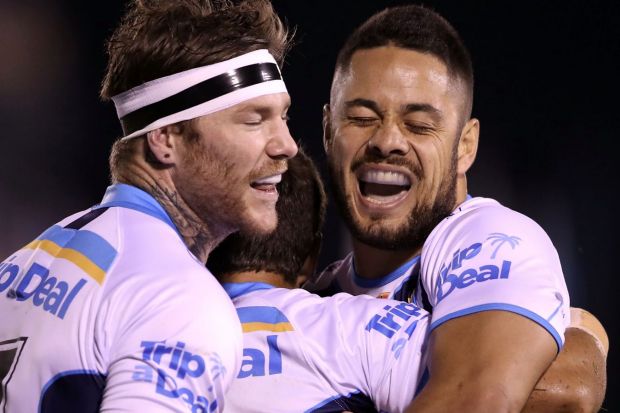 Back to his best: Jarryd Hayne celebrates with teammates during the Titans' win over the Sharks.