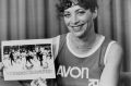 Switzer, pictured in 1983 holding a series of photographs depicting an official attempting to force her from the course ...