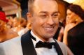 Family Feud host Grant Denyer went for contrasting lapels on the Logies red carpet.