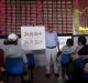 An investor holds a board showing "government saves the market so that investors will be happy" in Shanghai in 2015.  ...