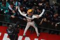 Meet and greet: Race winner Lewis Hamilton celebrates his win in Shanghai.