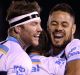 Back to his best: Jarryd Hayne celebrates with teammates during the Titans' win over the Sharks.