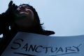 Demonstrators chant against US President Donald Trump's executive order  on "sanctuary cities" in Cincinnati in January. 