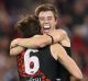 Joe Daniher of the Bombers is congratulated by Zach Merrett after kicking a goal in the final quarter of the Anzac Day match.